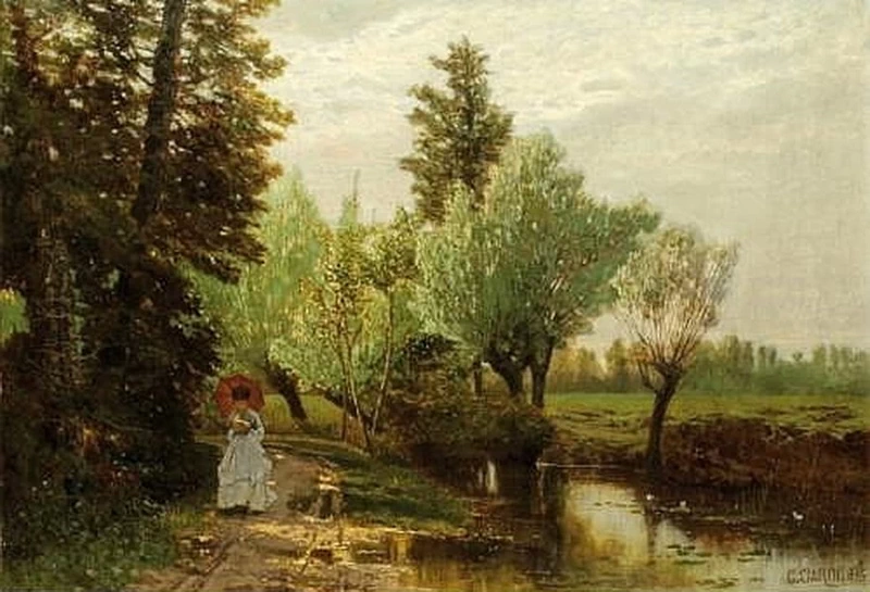 Giovane donna che legge sulle rive di un fiume